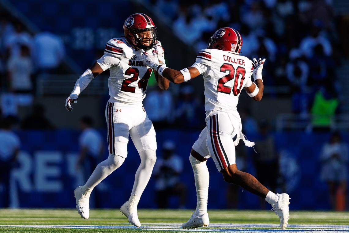 Sep 7, 2024; Lexington, Kentucky, USA; South Carolina Gamecocks defensive back Judge Collier (20) celebrates with defensive back Jalon Kilgore (24) after Kilgore intercepted a Kentucky Wildcats pass during the fourth quarter at Kroger Field. Mandatory Credit: Jordan Prather-Imagn Images