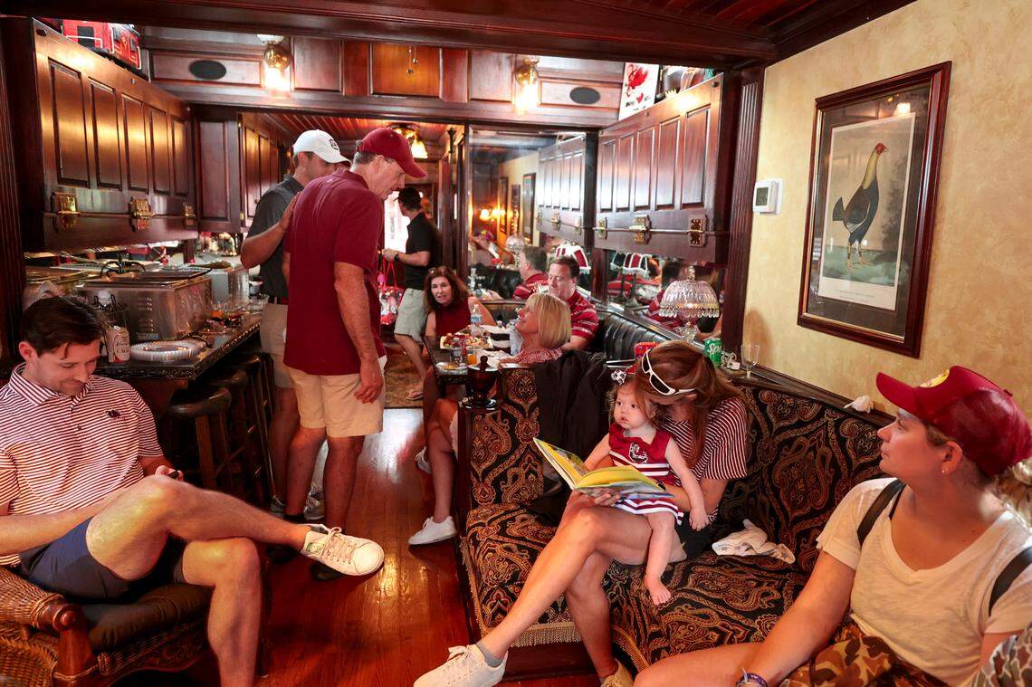 Joe Boland and friends and family members relax in a Cockaboose before the USC game against LSU on Saturday, Sept. 14, 2024.