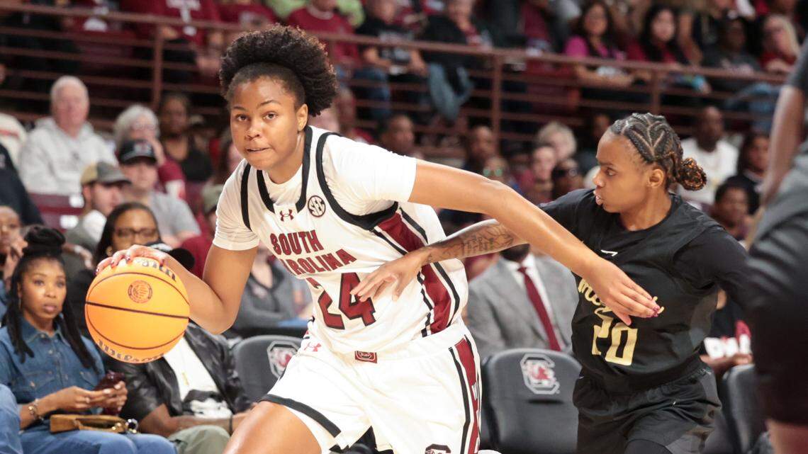 University of South Carolina's Ayla McDowell (24) drives down court as Anderson's Key Barnes (20) follows during the first half of action at the Colonial Life Arena on Friday Oct. 24, 2025.