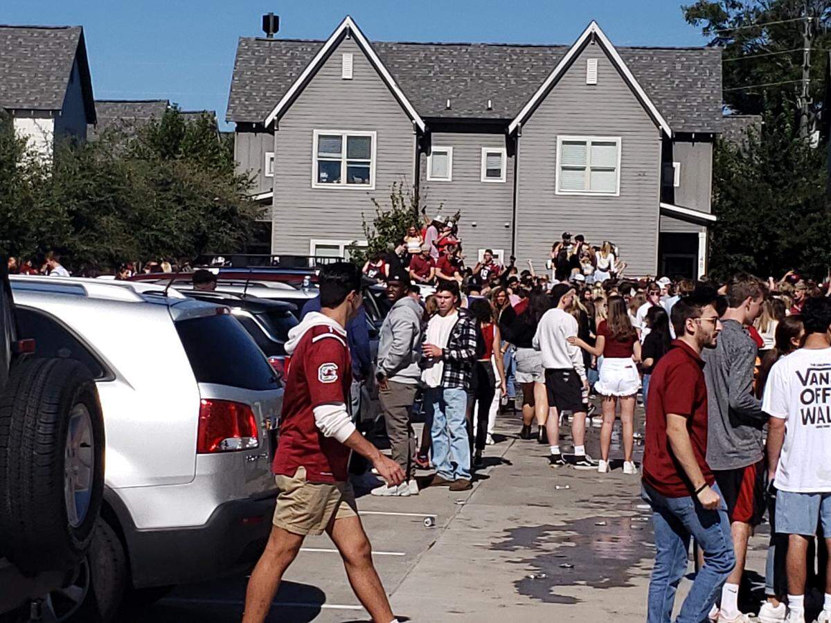 A crowd of at least a couple thousand people gathered at the Orchard rental complex, according to the Columbia Fire Department.