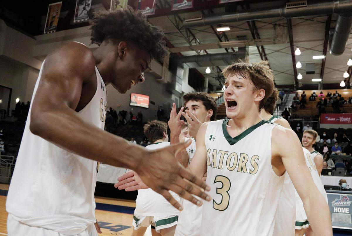 River Bluff’s Myles Jenkins 0 congratulates Landon Stills 3 after they defeated Dorman in Aiken, South Carolina on Saturday, March 6, 2021.
