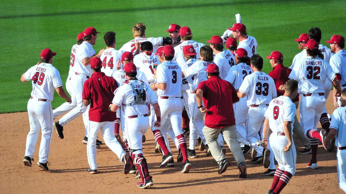 The South Carolina Gamecocks baseball team celebrates after beating Mississippi State on May 9, 2021.