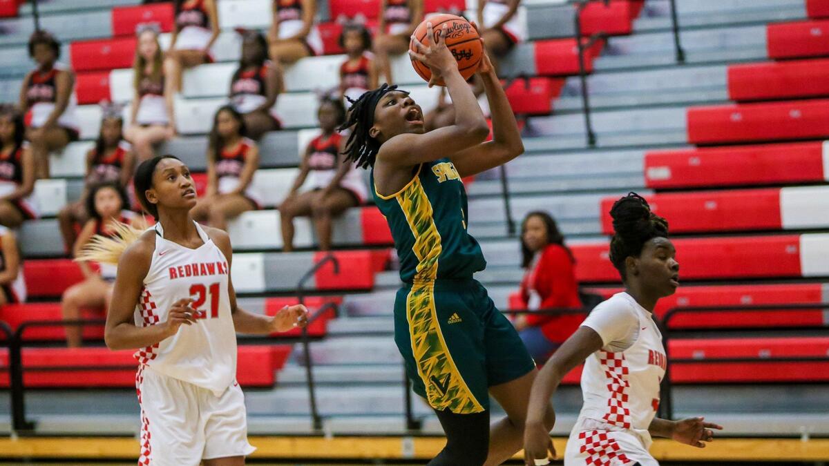 Spring Valley Vikings Taylor Lewis (3) drives against the Westwood Redhawks during their game.