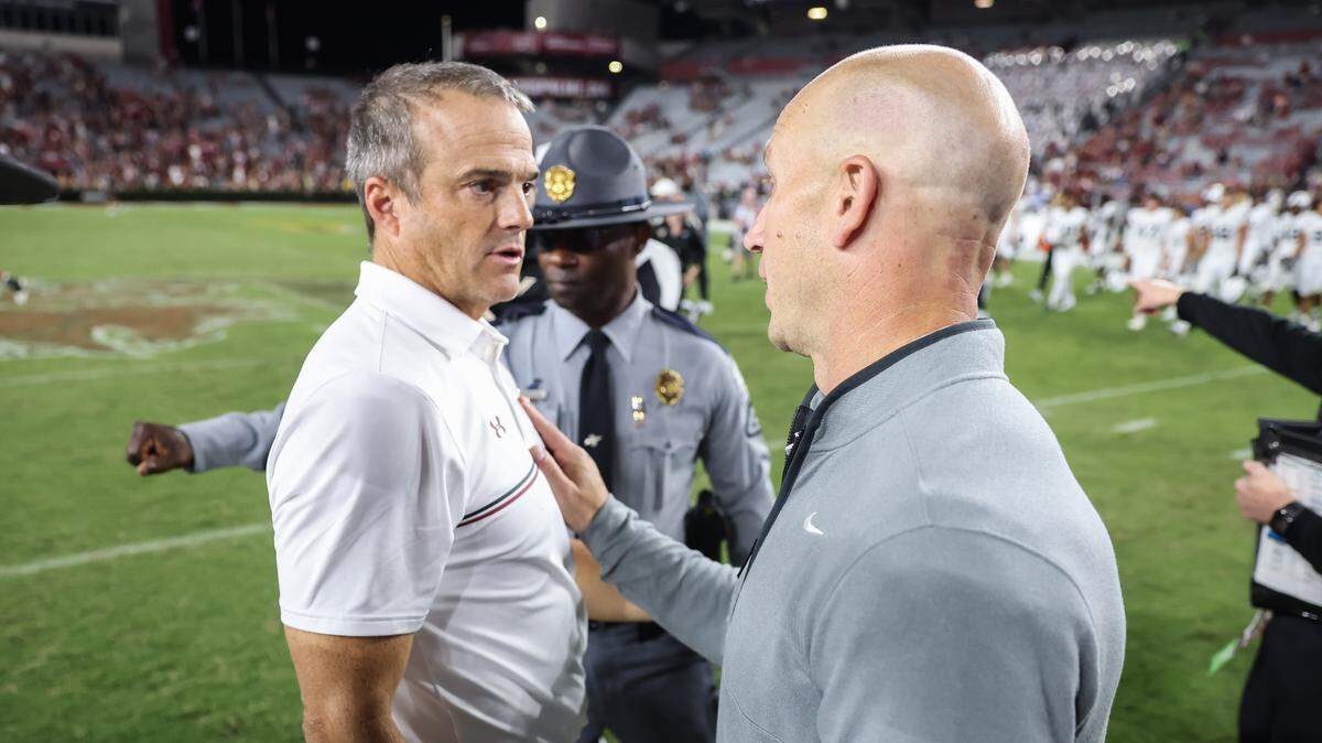 South Carolina head coach Shane Beamer meets with Vanderbilt head coach Clark Lea at midfield following the Gamecocks’ game against Vanderbilt at Williams-Brice Stadium in Columbia on Saturday, September 13, 2025.


