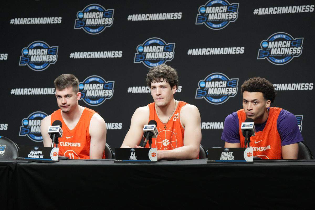 Mar 27, 2024; Los Angeles, CA, USA; Clemson Tigers guard Joseph Girard III (left), center PJ Hall (center) and guard Chase Hunter during a press conference prior to NCAA Tournament at West Regional at Crypto.com Arena.