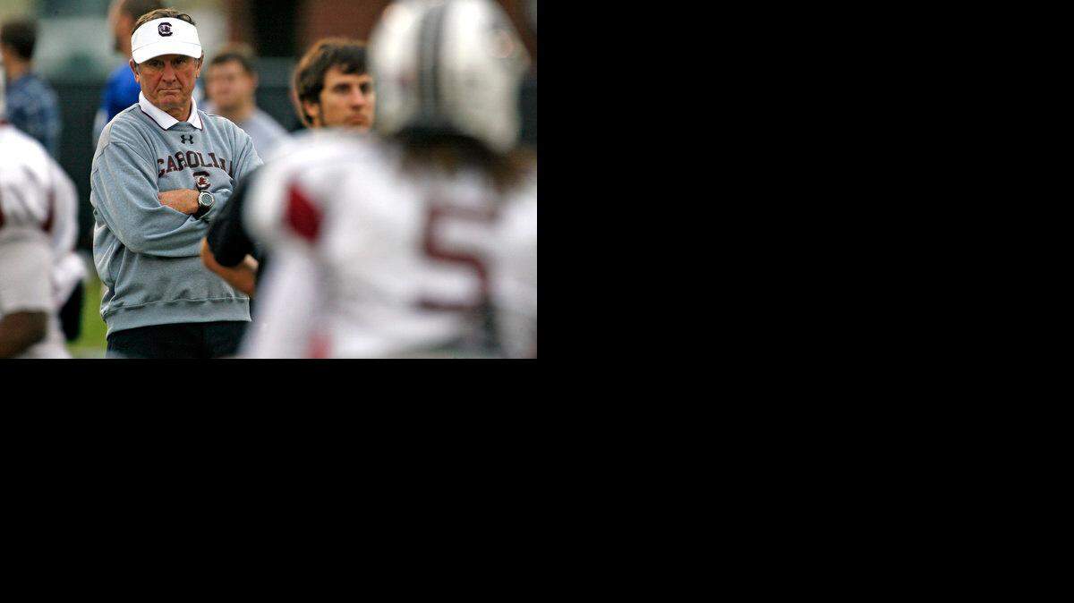 USC head football coach Steve Spurrier watches as the Gamecocks run through drills during practice.