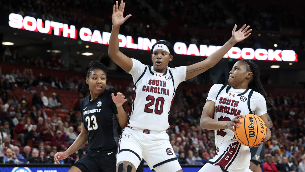 University of South Carolina’s Sania Feagin (20) blocks Vanderbilt’s Iyana Moore (23) as University of South Carolina’s MiLaysia Fulwiley (12) makes for the goal during the first half of action in the SEC Tournament at the Bon Secours Wellness Arena in Greenville on Friday, Mar. 7, 2025.