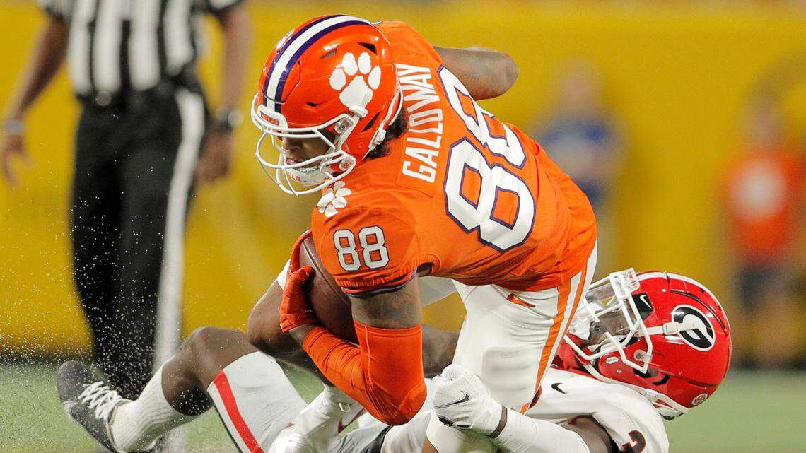 Georgia defensive back Latavious Brini (36) brings down Clemson tight end Braden Galloway (88) during second-quarter action of the Duke’s Mayo Classic in Charlotte, N.C. on Saturday, Sept. 4, 2021.