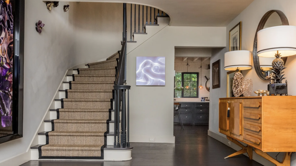 The living room and dining area flank the entry to the Adger’s Wharf home.