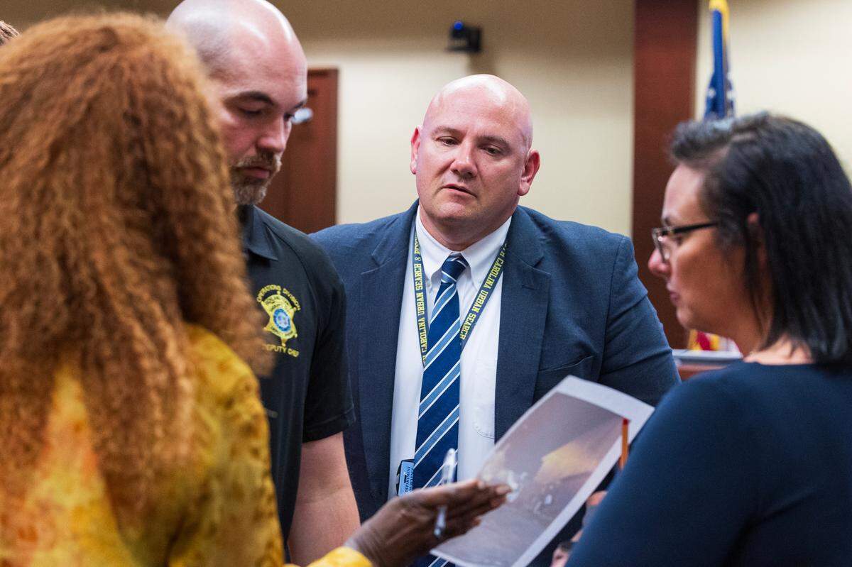 South Carolina Department of Revenue attorney Patrick McCabe speaks with Gwendolyn Singletary, Executive Director of the Wiley Kennedy Foundation, during a hearing at the South Carolina Administrative Law Court on Wednesday, April 30, 2025.