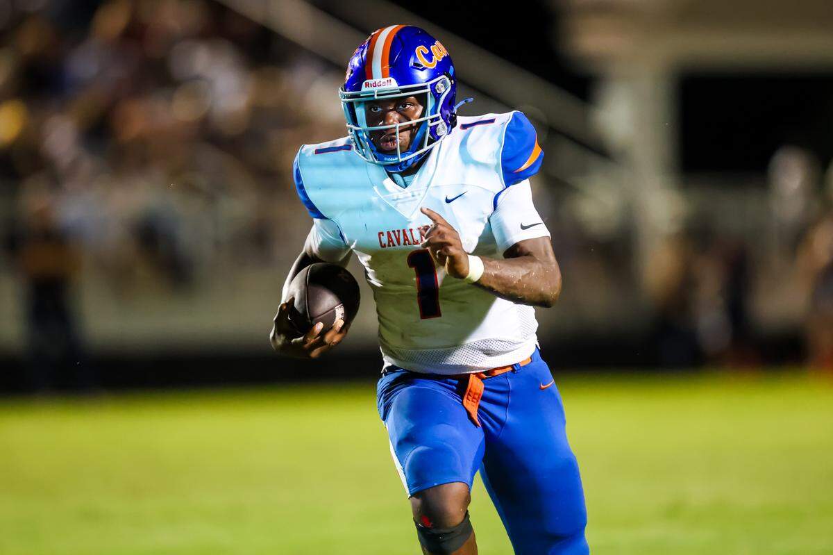 RNE quarterback Will Wilson (1) rushes for a touchdown against the Camden Bulldogs during their game at Camden High School Friday, 9/20/24.