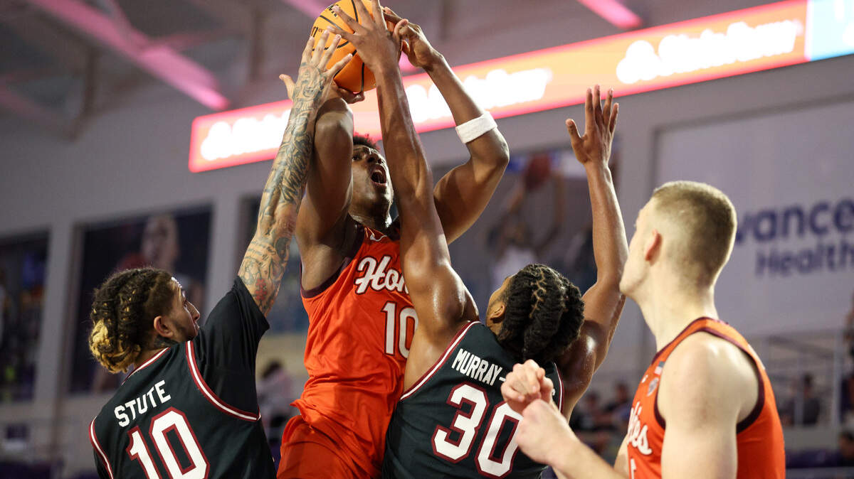 Virginia Tech Hokies guard Tyler Johnson (10) attempts a shot guarded by South Carolina Gamecocks forward Collin Murray-Boyles (30) and guard Myles Stute (10) in the first half at Suncoast Credit Union Arena.