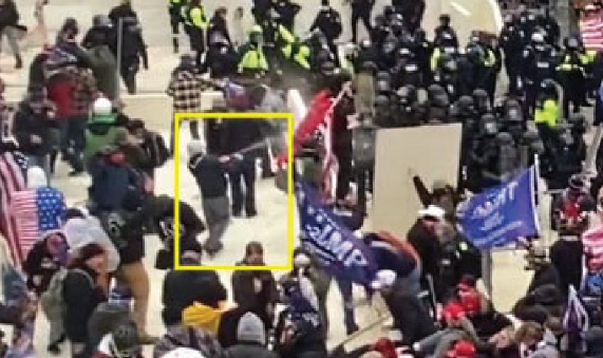 A federal criminal complaint allegedly shows Justin Perrou of Charleston shooting chemical sprays at police on Jan. 6, 2021, at the U.S. Capitol.