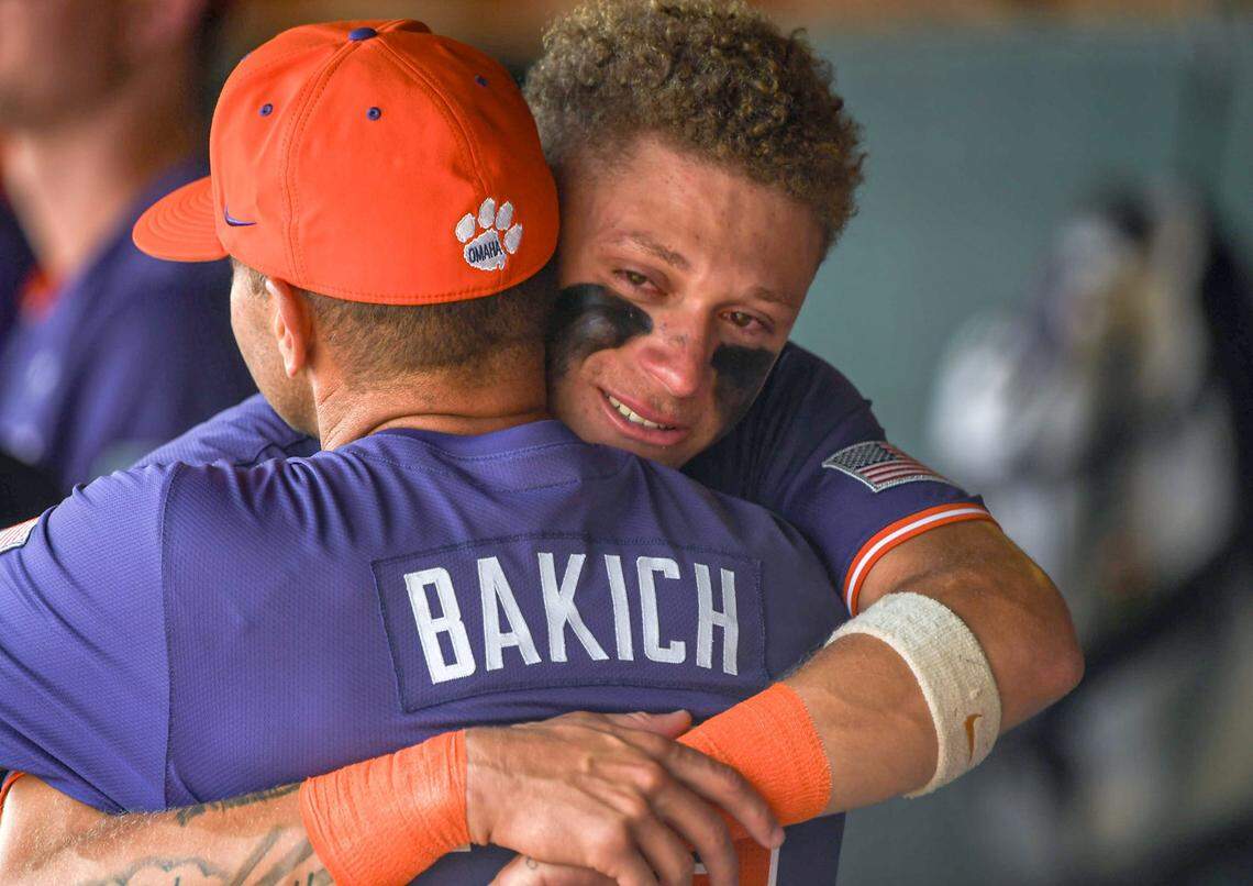 Clemson Head Coach Erik Bakich gets a hug from Clemson outfielder Cam Cannarella (10) after the NCAA baseball Clemson Regional at Doug Kingsmore Stadium in Clemson, S.C. Sunday, June 1, 2025. Kentucky won 16-4, ending Clemson’s season.