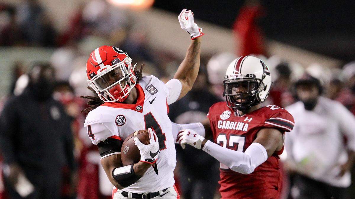 Georgia’s James Cook gains yardage Saturday against South Carolina in the game played at Williams-Brice Stadium.
