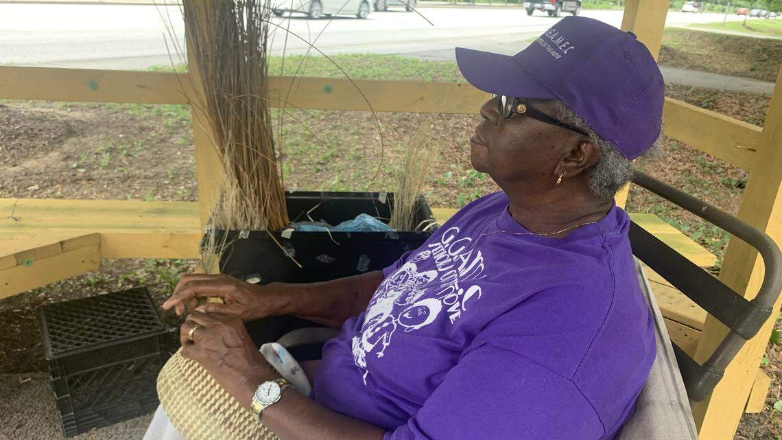 Betty Manigault waits for a car to stop on a recent Friday afternoon as motorists zip past her stand on south Highway 17, heading into Mount Pleasant from Awendaw. She was 6 years old when her grandmother taught her how to make sweetgrass baskets.
