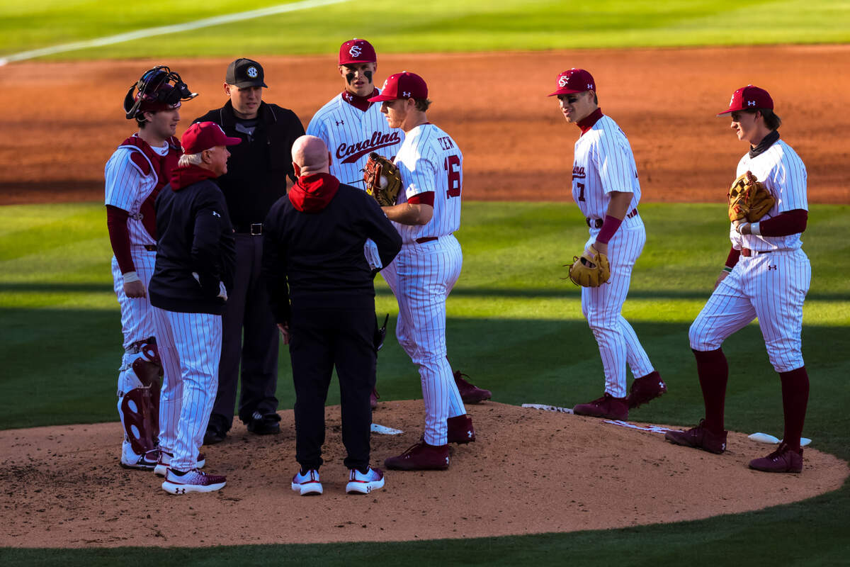 South Carolina Gamecocks head coach Paul Mainieri checks on pitcher Dylan Eskew (16) during their game at Founders Park 2/21/25.