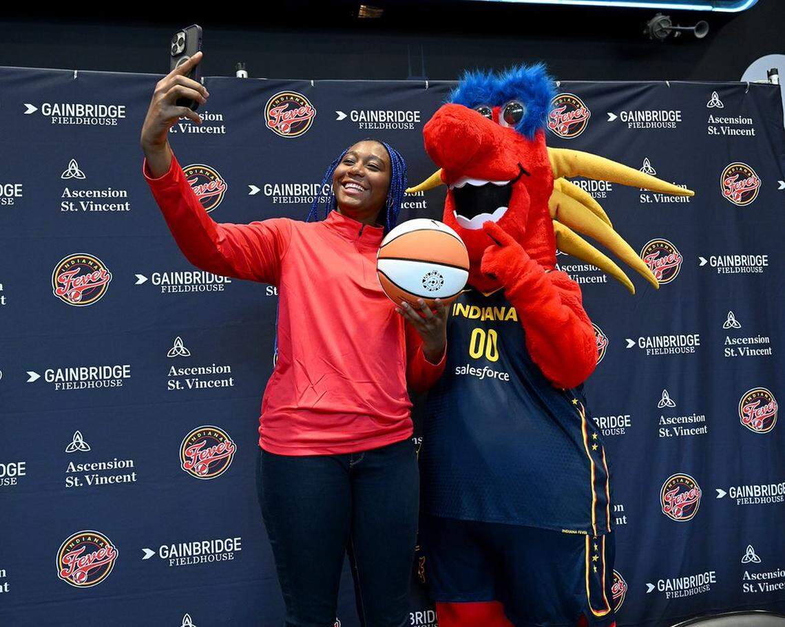 Former South Carolina women’s basketball star Aliyah Boston poses with the mascot during her introductory news conference with the Indiana Fever on Monday, April 24, 2023. The Fever picked Boston No. 1 overall in this month’s WNBA Draft.