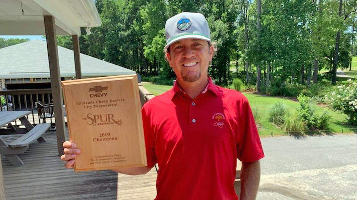 Jarrett Grimes displays winner’s trophy after winning his second Midlands Chevy Dealers Columbia City Golf Championship.