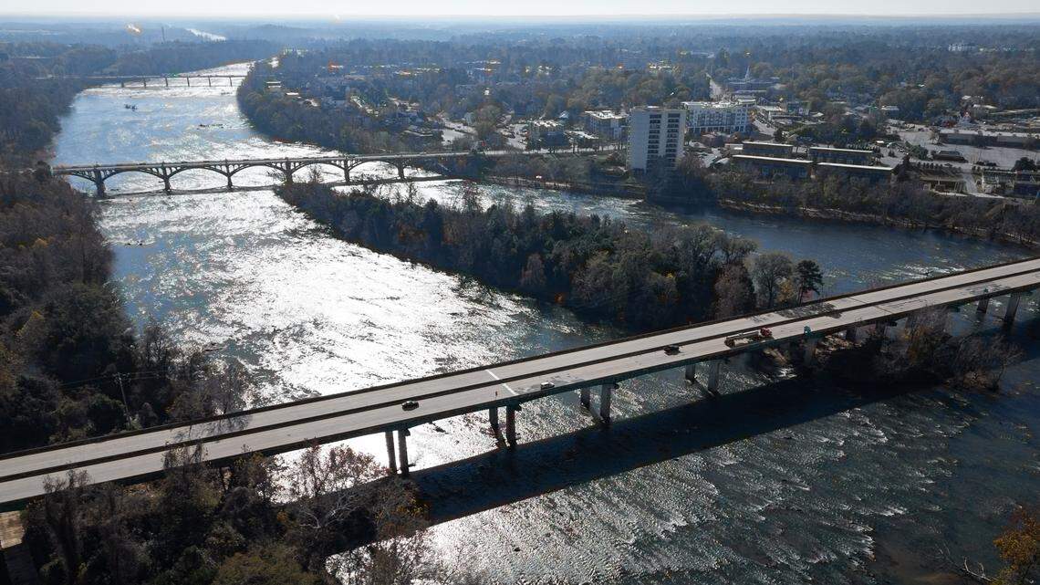 Cars drive over patched potholes on the Jarvis Klapman Bridge between Columbia and West Columbia, South Carolina on Wednesday, December 10, 2025.