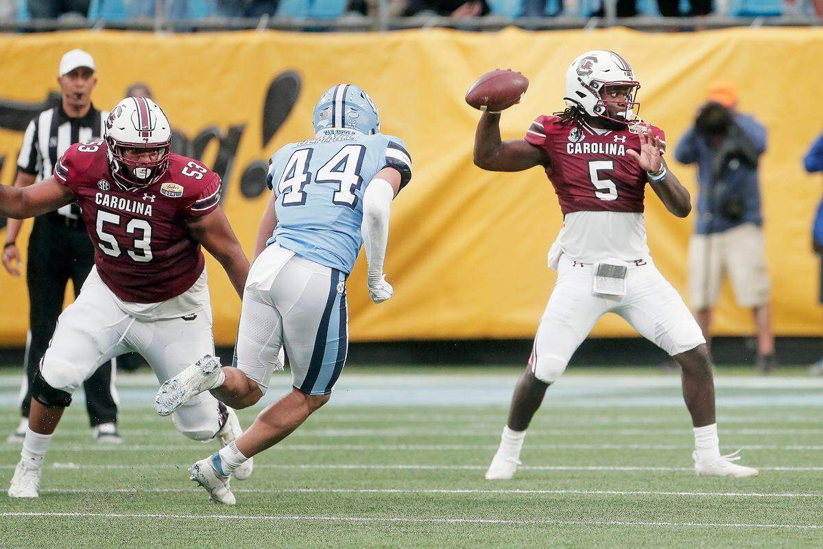South Carolina Gamecocks quarterback Dakereon Joyner (5) passes the ball during the game against North Carolina at the Duke’s Mayo Bowl at Bank of America Stadium in Charlotte, North Carolina on Thursday, December 30, 2021.