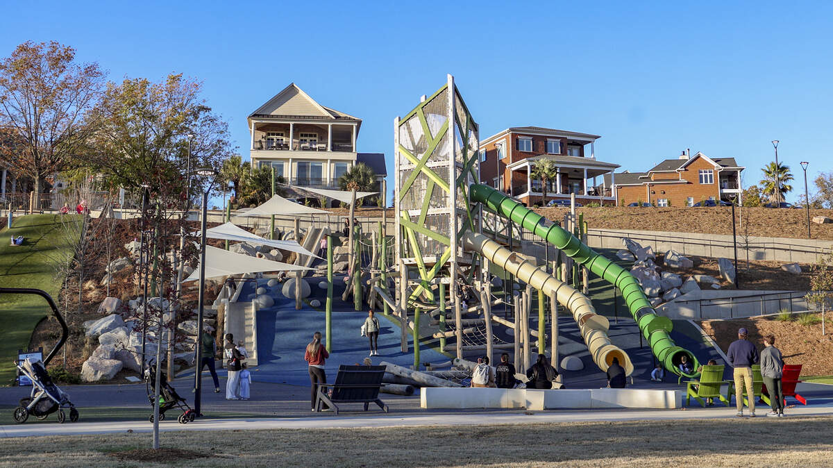 Children play on the playground at Finlay park on Wednesday, Dec. 10, 2025.