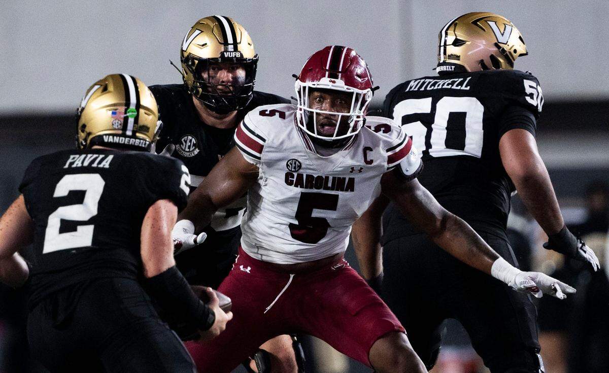 South Carolina Gamecocks edge Kyle Kennard (5) reacts as Vanderbilt Commodores quarterback Diego Pavia (2) protects the ball during the second half at FirstBank Stadium in Nashville.