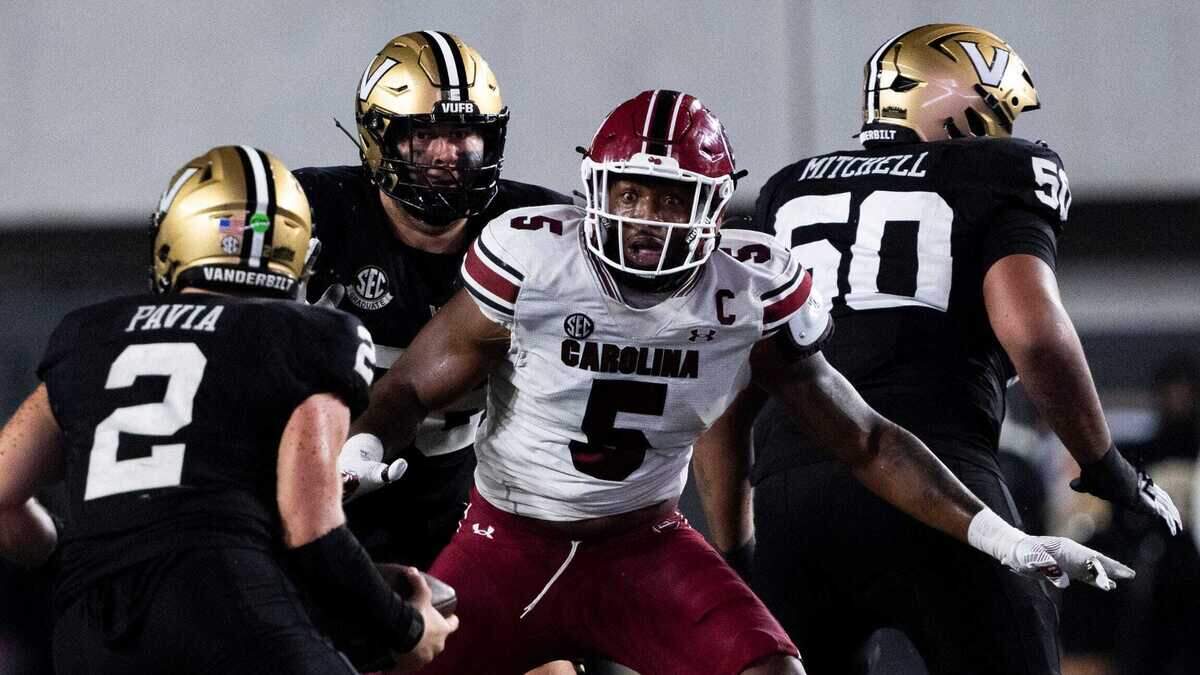 South Carolina Gamecocks edge Kyle Kennard (5) reacts as Vanderbilt Commodores quarterback Diego Pavia (2) protects the ball during the second half at FirstBank Stadium in Nashville.
