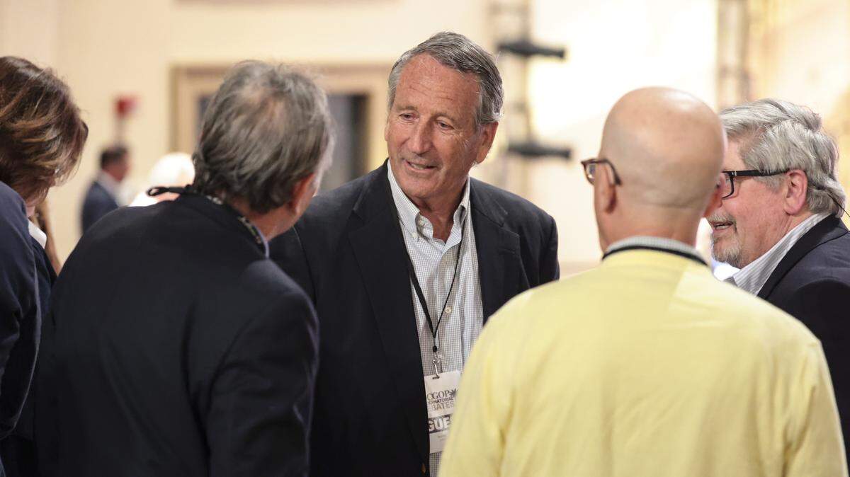 Former South Carolina Governor Mark Sanford chats at the Sottile Theater in Charleston on Tuesday, April 21, 2026. Sanford attended a GOP debate for candidates for governor.