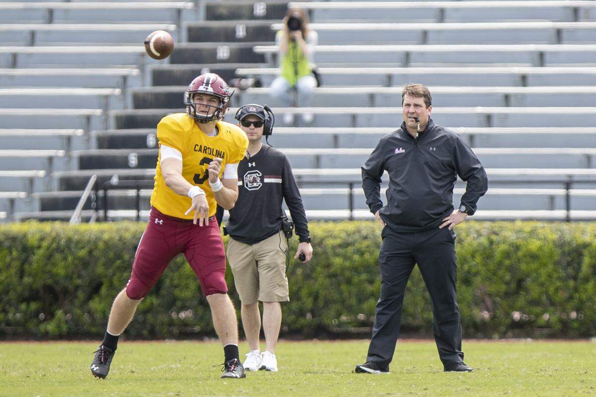 South Carolina head coach Will Muschmp watches the scrimmage from the field as South Carolina’s Ryan Hilinski (3) during South Carolina’s spring game at Williams-Brice Stadium Stadium Saturday, April 6, 2019, in Columbia, SC.