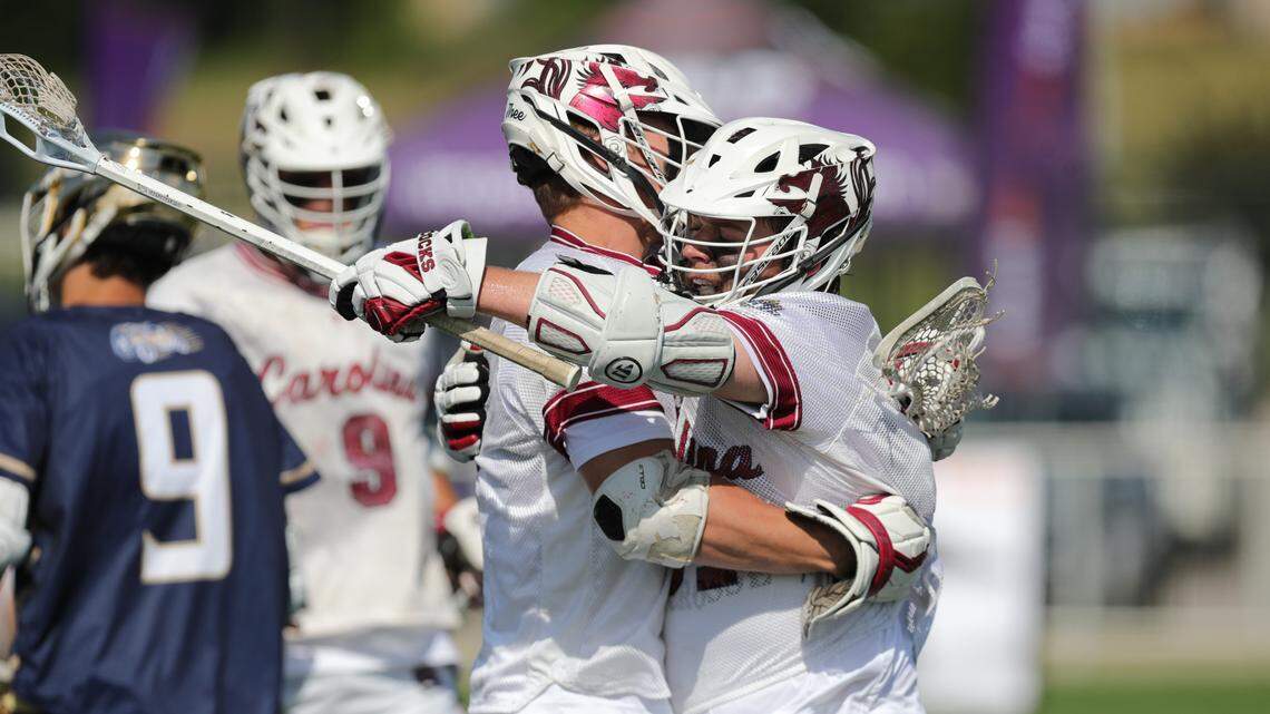 Members of the South Carolina men’s lacrosse club embrace in the 2022 MCLA national championship.
