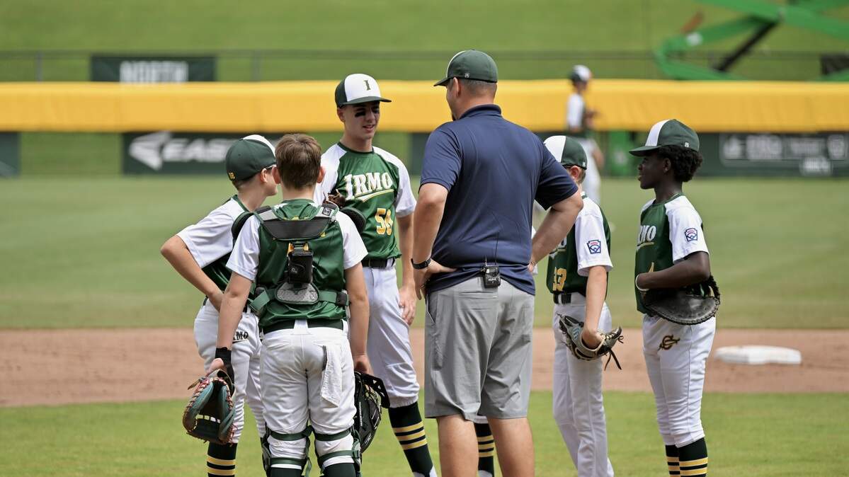 Irmo Little League coach David Bogan talks to his players during a mound visit this summer.