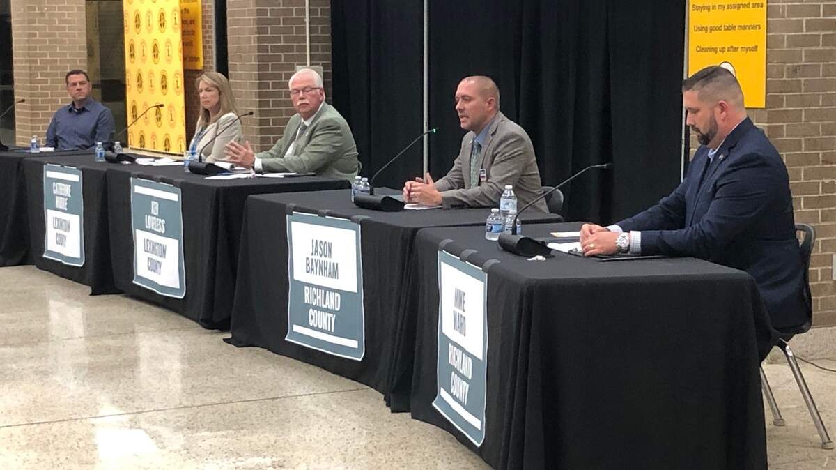 Candidates for the Lexington-Richland 5 school board at a forum at Irmo Middle School on Oct. 8, 2024. From left are Scott Herring, Catherine Huddle, Ken Loveless, Jason Baynham and Mike Ward.