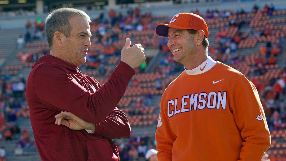 South Carolina coach Shane Beamer and Clemson coach Dabo Swinney before the teams’ 2024 football rivalry game