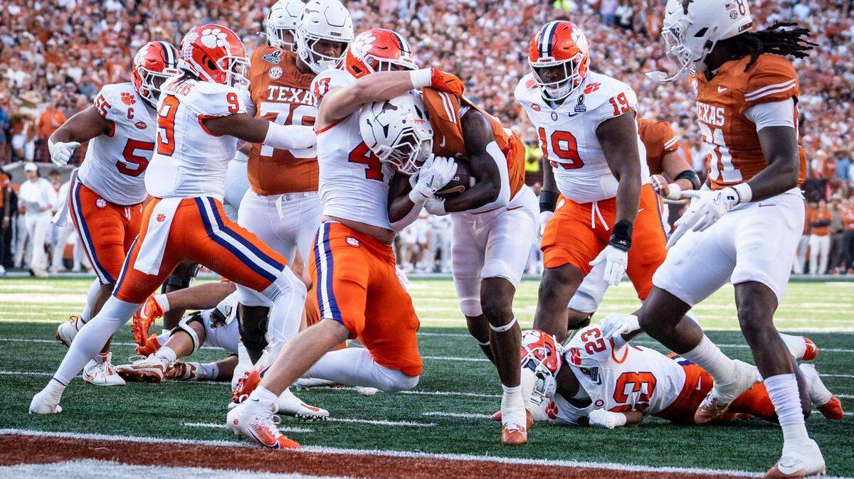 Texas Longhorns running back Quintrevion Wisner (26) carries the ball into the end zone to score the Longhorns’ first touchdown as Texas plays the Clemson Tigers in the first round of the College Football Playoffs at Darrell K Royal Texas Memorial Stadium in Austin, Texas, Dec. 21, 2024.