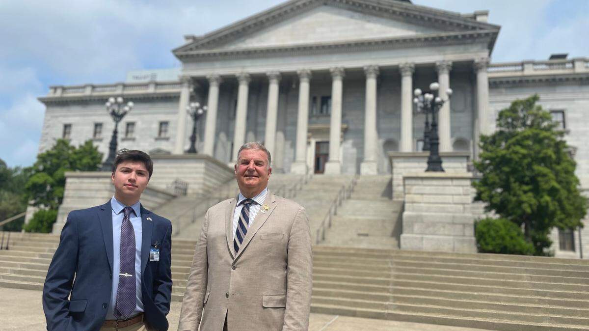Elias Irizarry and state Rep. David O’Neal pictured outside the State House in Columbia, S.C., on April 6, 2023.