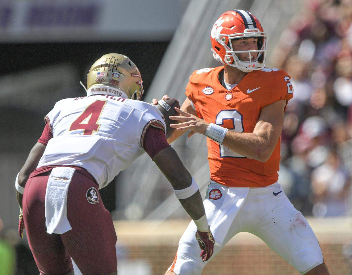 Sep 23, 2023; Clemson, South Carolina, USA; Florida State Seminoles linebacker Karen DeLoach (4) hits Clemson Tigers quarterback Cade Klubnik (2) To knock the ball loose before picking up the fumble and returning it for a touchdown during the third quarter at Memorial Stadium. Mandatory Credit: Ken Ruinard-USA TODAY Sports