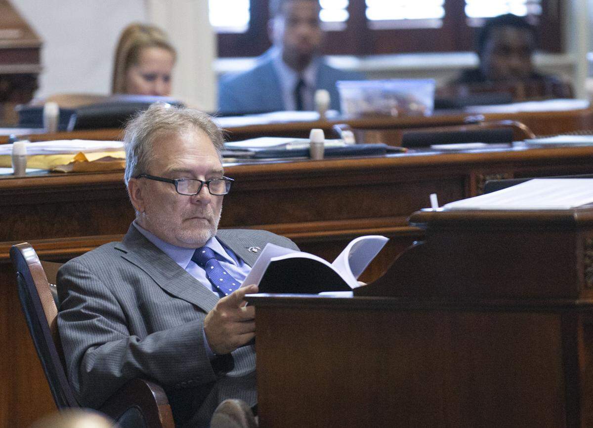 Senator Brad Hutto, D.-Orangeburg reviews a presentation from Sen. Dick Harpootlian concerning the bill facilitating the relocation of the Carolina Panther’s training facility to South Carolina.