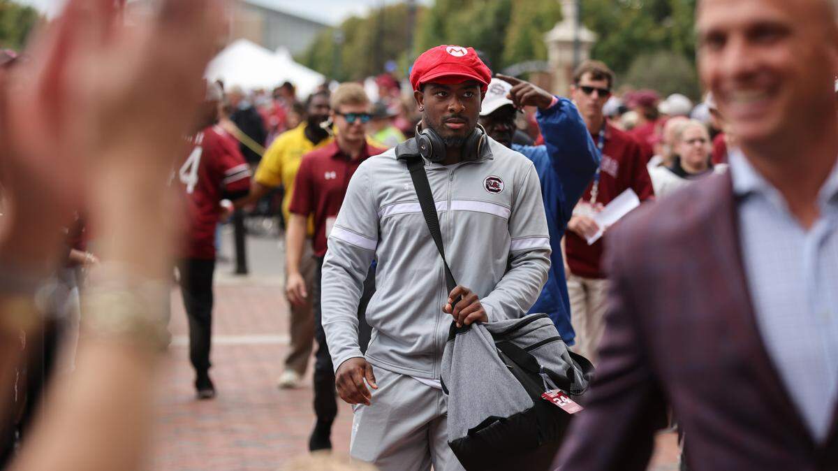 South Carolina running back Mario Anderson (24) wears a Mario hat as he makes his way in during the Gamecock Walk before South Carolina’s game at Williams-Brice Stadium in Columbia on Saturday, October 14, 2023.