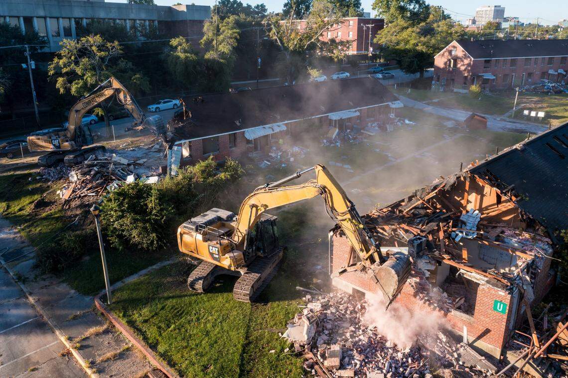 Crews demolish Allen Benedict Court Tuesday morning. The housing complex was built in 1940.