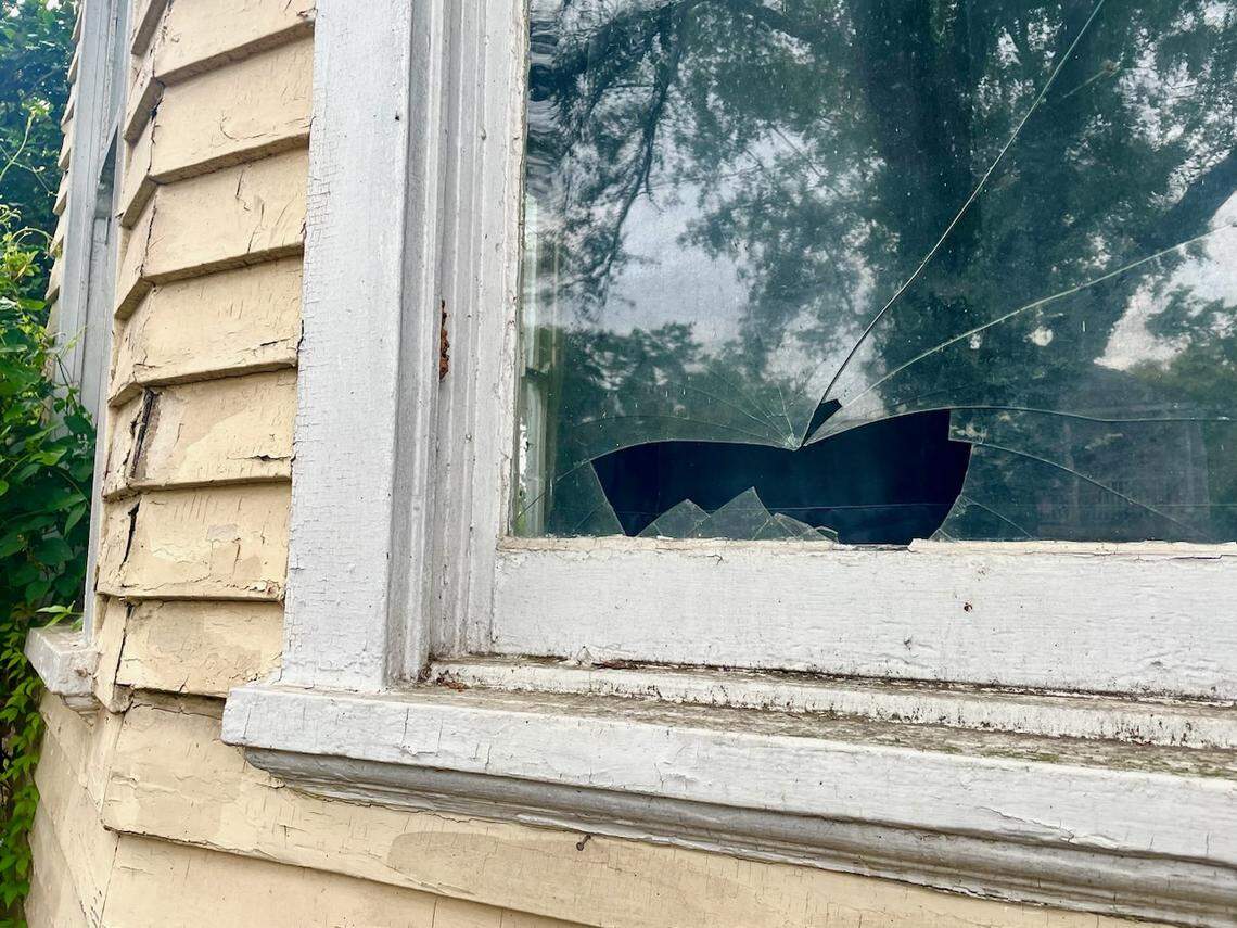 Residents of Columbia’s Elmwood Park neighborhood have filed a lawsuit against the investment group that owns a historic house on Lincoln Street, which has fallen into severe disrepair and, neighbors say, has become a dangerous nuisance. One of multiple broken windows on the house is seen on Thursday, June 8, 2023.