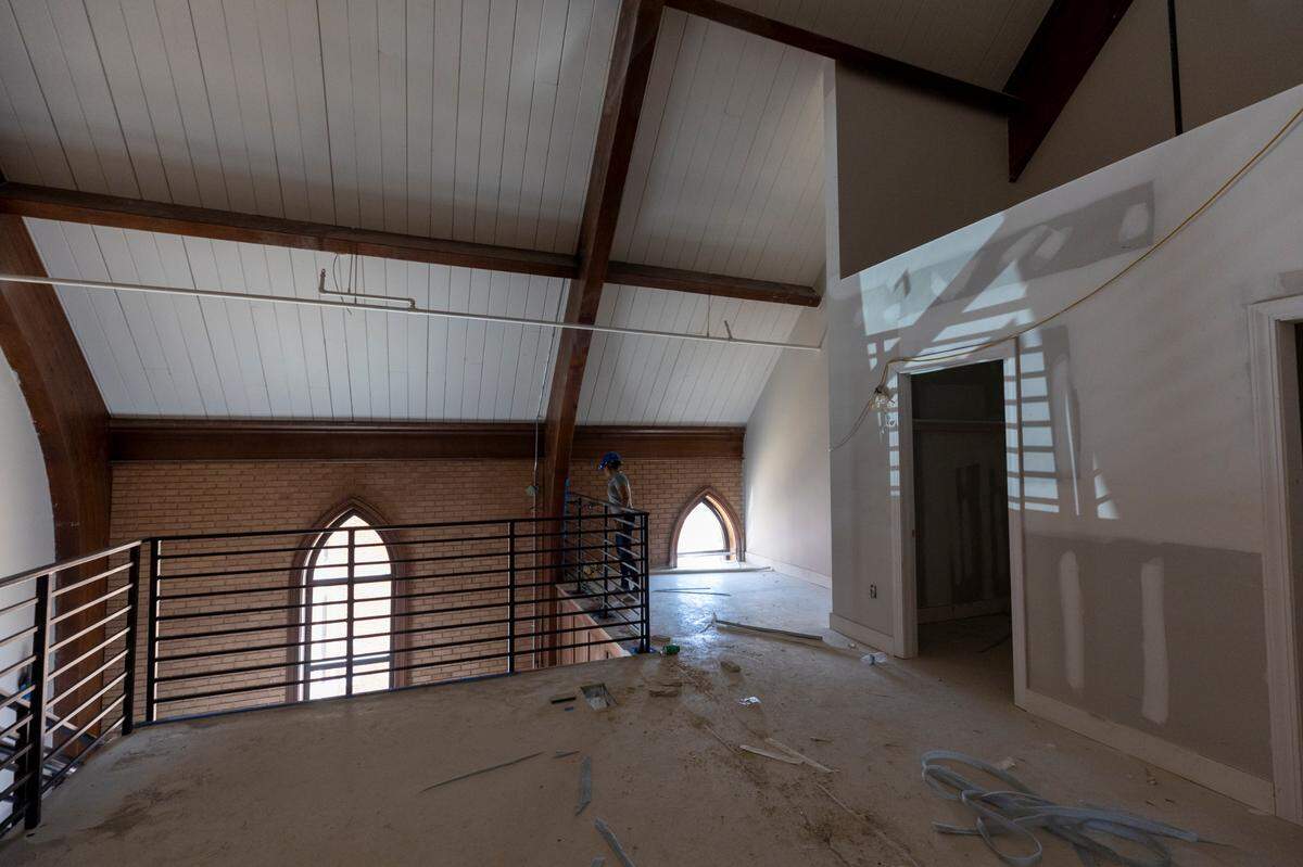 The former site of Rosewood Church is being transformed into three apartment buildings. The sanctuary of the church will include eight apartment units, some of which have second story lofts.