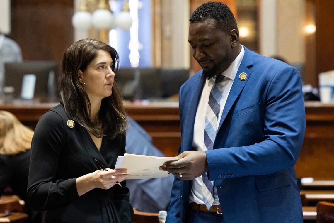 State Representative Heather Bauer, D-Richland, speaks with State Representative Jermaine Johnson, D-Richland, in the South Carolina House on Tuesday, January 10, 2023. 