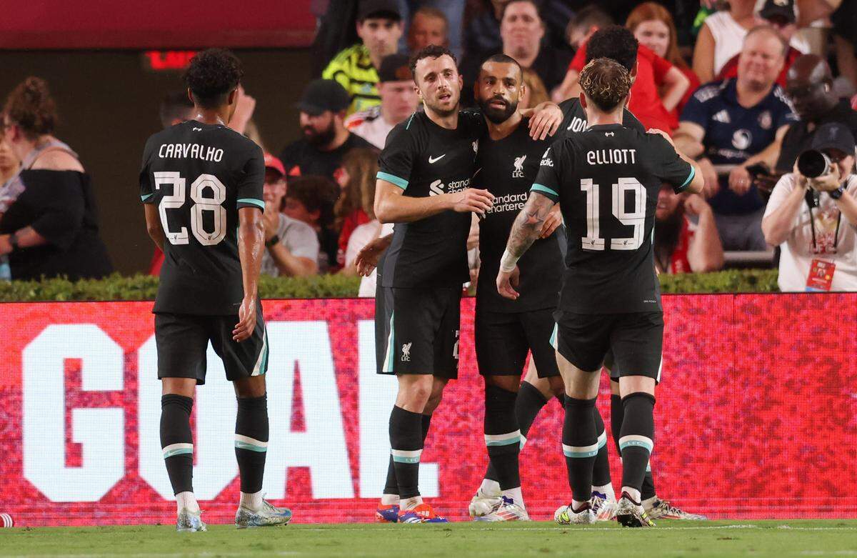 Liverpool forward Mohamed Salah (11) is congratulated after a goal during the Rivals in Red International Friendly soccer match between Manchester United and Liverpool in Columbia on Saturday, August 3, 2024.