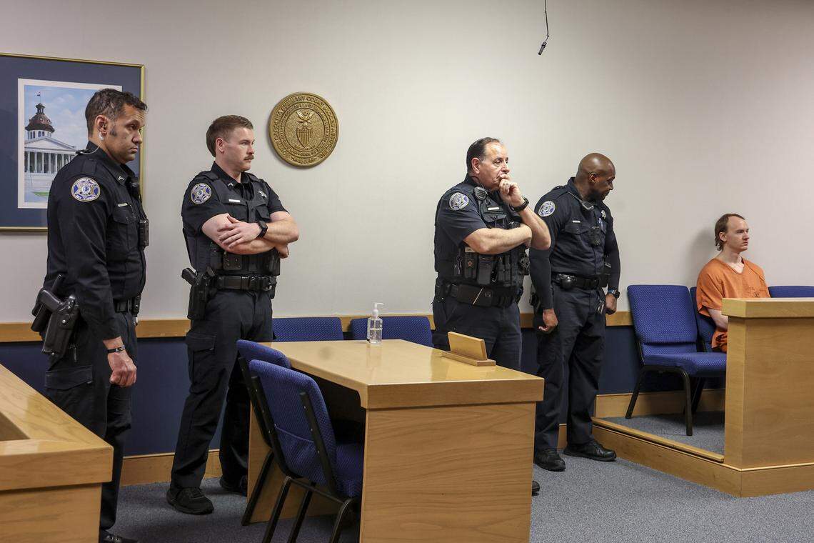 Lexington County Sheriff’s Deputies stand by as Cameron Thomas Hinckley sits in Irmo Magistrate Court on Friday, Feb. 13, 2026. Hinckley is charged with attempted murder and first-degree burglary for allegedly attacking Bruce Loveless in 2023. 