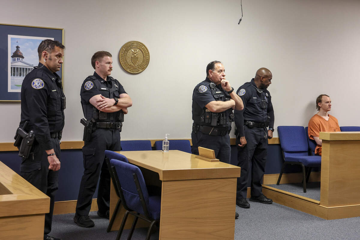 Lexington County Sheriff’s Deputies stand by as Cameron Thomas Hinckley sits in Irmo Magistrate Court on Friday, Feb. 13, 2026. Hinckley is charged with attempted murder and first-degree burglary for allegedly attacking Bruce Loveless in 2023.