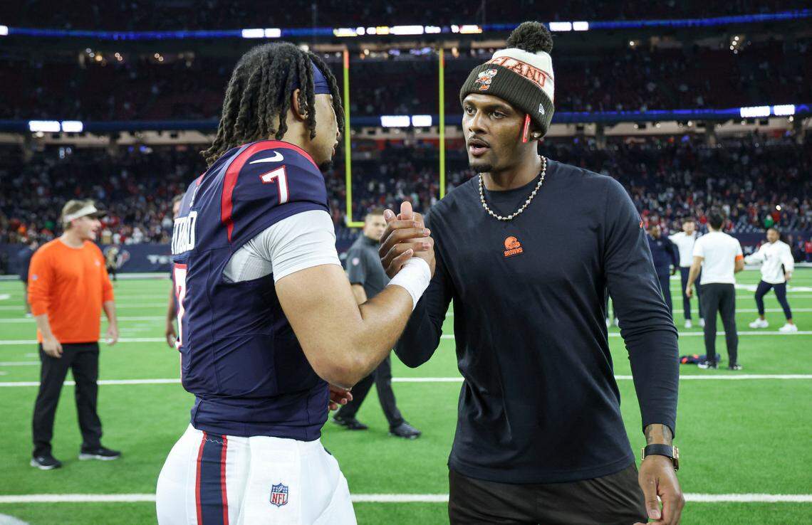 Jan 13, 2024; Houston, Texas, USA; Houston Texans quarterback C.J. Stroud (7) and Cleveland Browns quarterback Deshaun Watson greet on the field after a 2024 AFC wild card game at NRG Stadium.