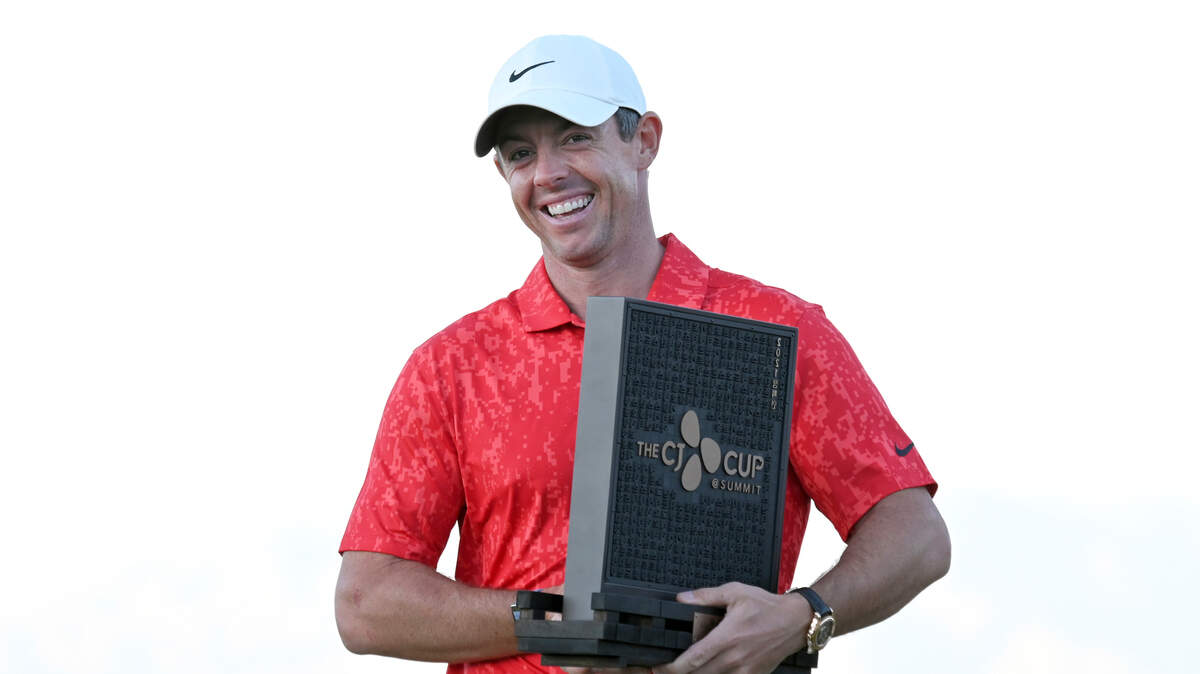 Rory McIlroy, of Northern Ireland, displays tournament trophy after winning CJ Cup golf tournament Sunday, Oct. 17, 2021, in Las Vegas.