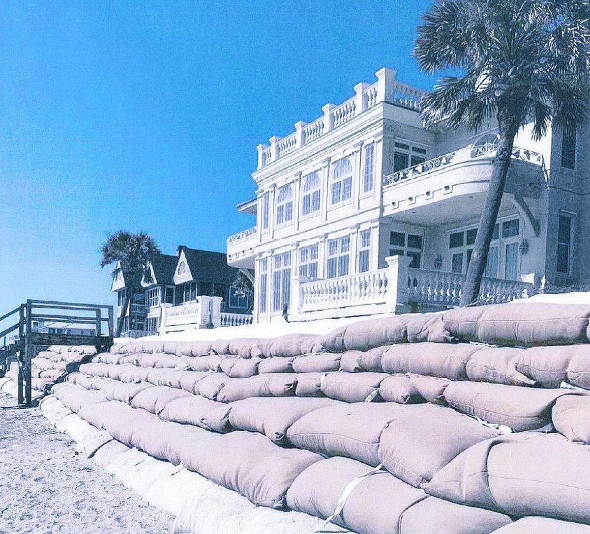This home at Debordieu Beach, SC, is being protected by a wall of sand bags. Critics say that is against state policy and bad for the beach.