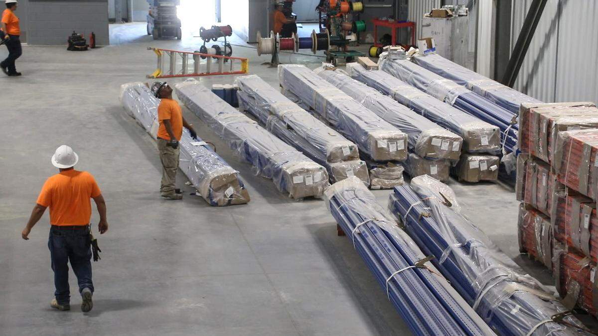 Workers during construction at the China Jushi fiberglass plant in Columbia. The Chinese company makes spun fiberglass and was a prized industrial recruit when it opened the $300 million plant in 2019. Sept. 20, 2018